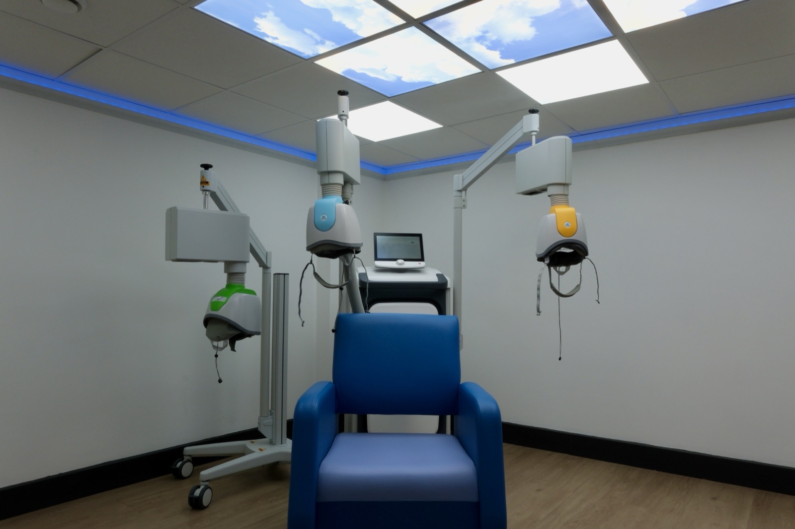 The Deep TMS treatment room, with the treatment chair and coil system