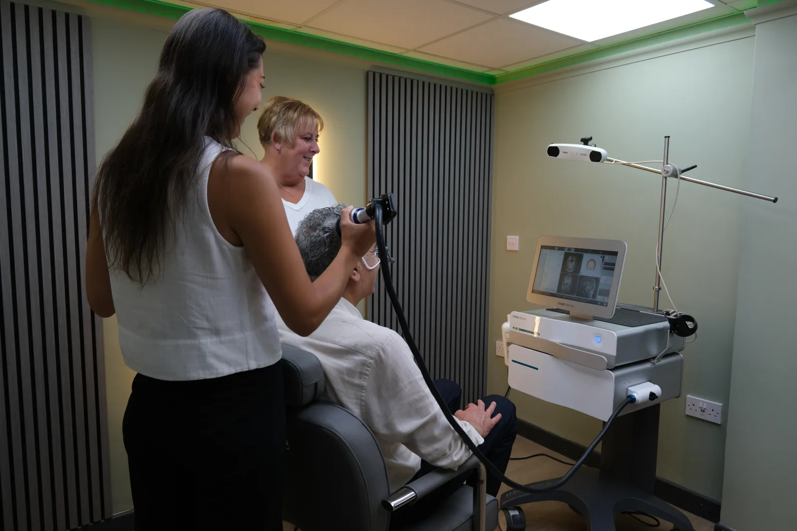 A clinician positioning the TPS handpiece